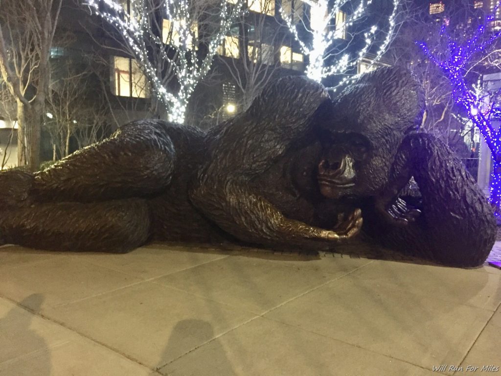 a statue of a gorilla lying down