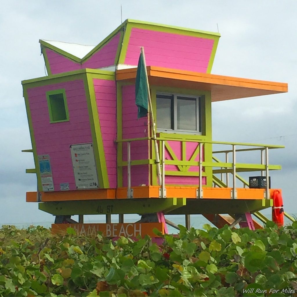 a colorful lifeguard tower on a beach