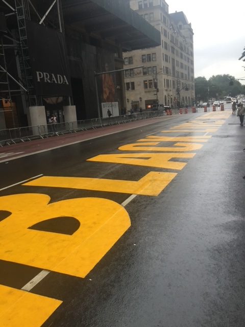 a yellow text painted on a street