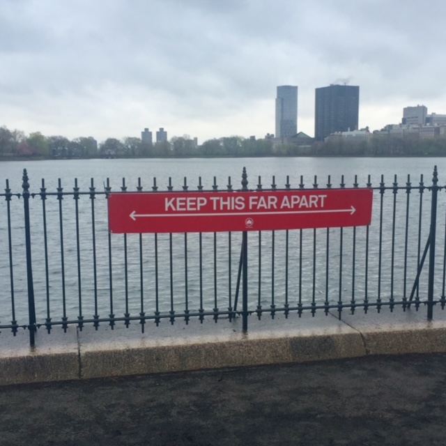 a red sign on a fence