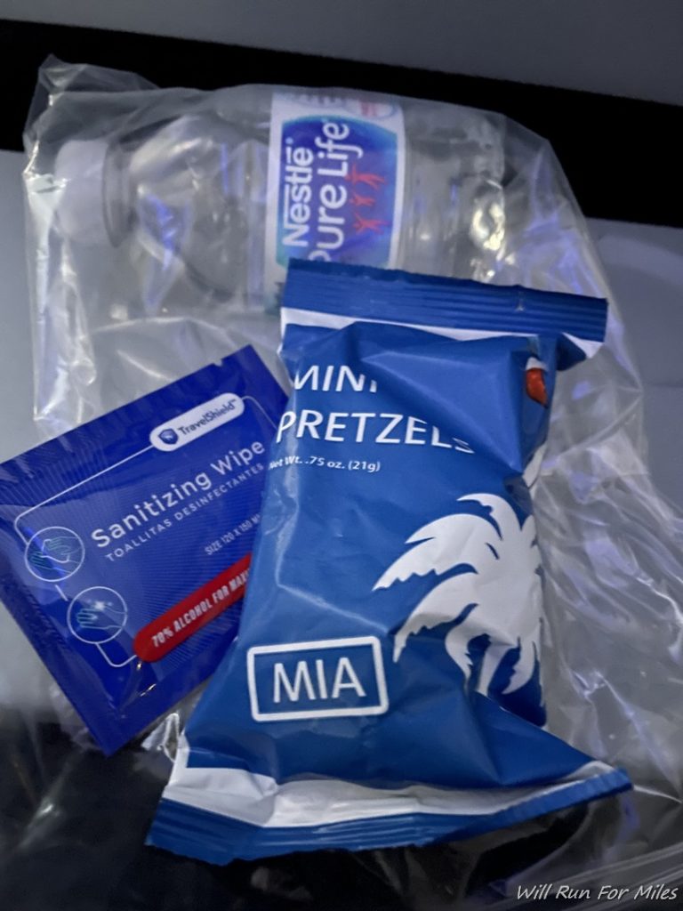 a plastic bag with a blue package and a blue package with a white logo