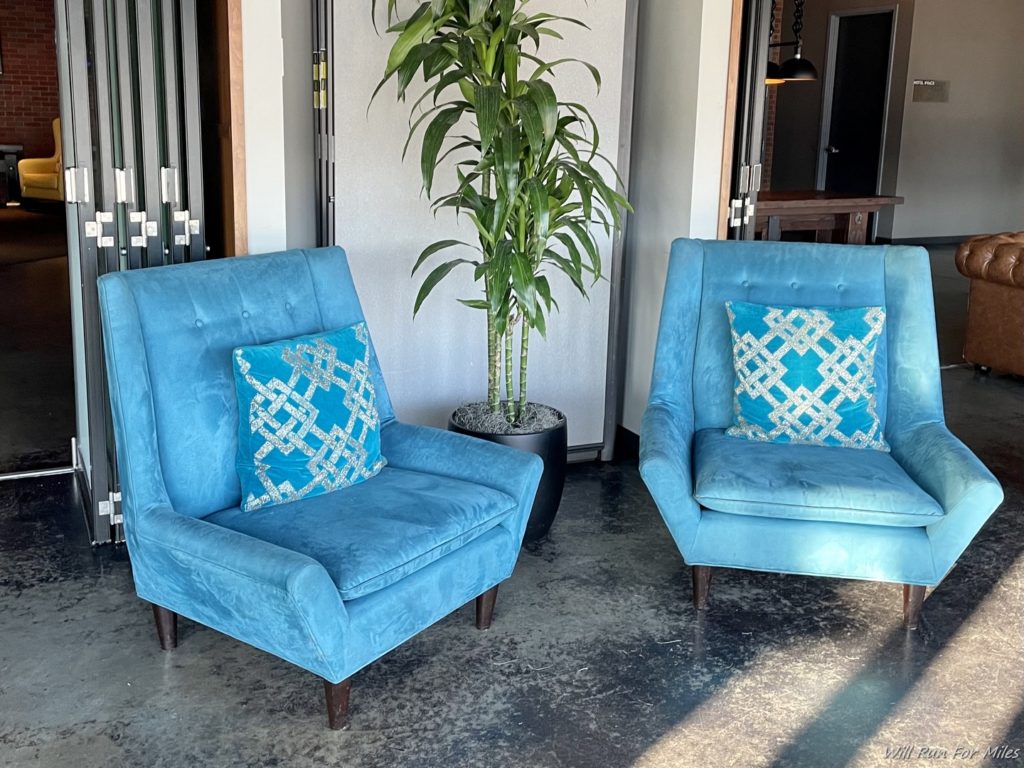 two blue chairs in a room