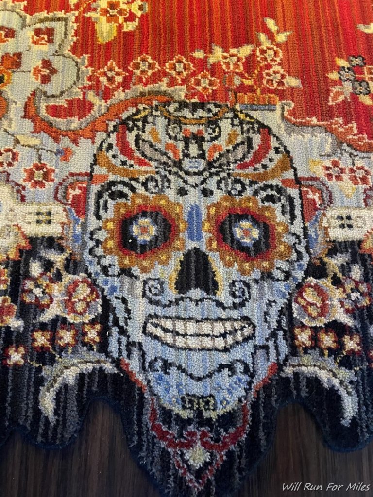 a colorful rug with a skull on it