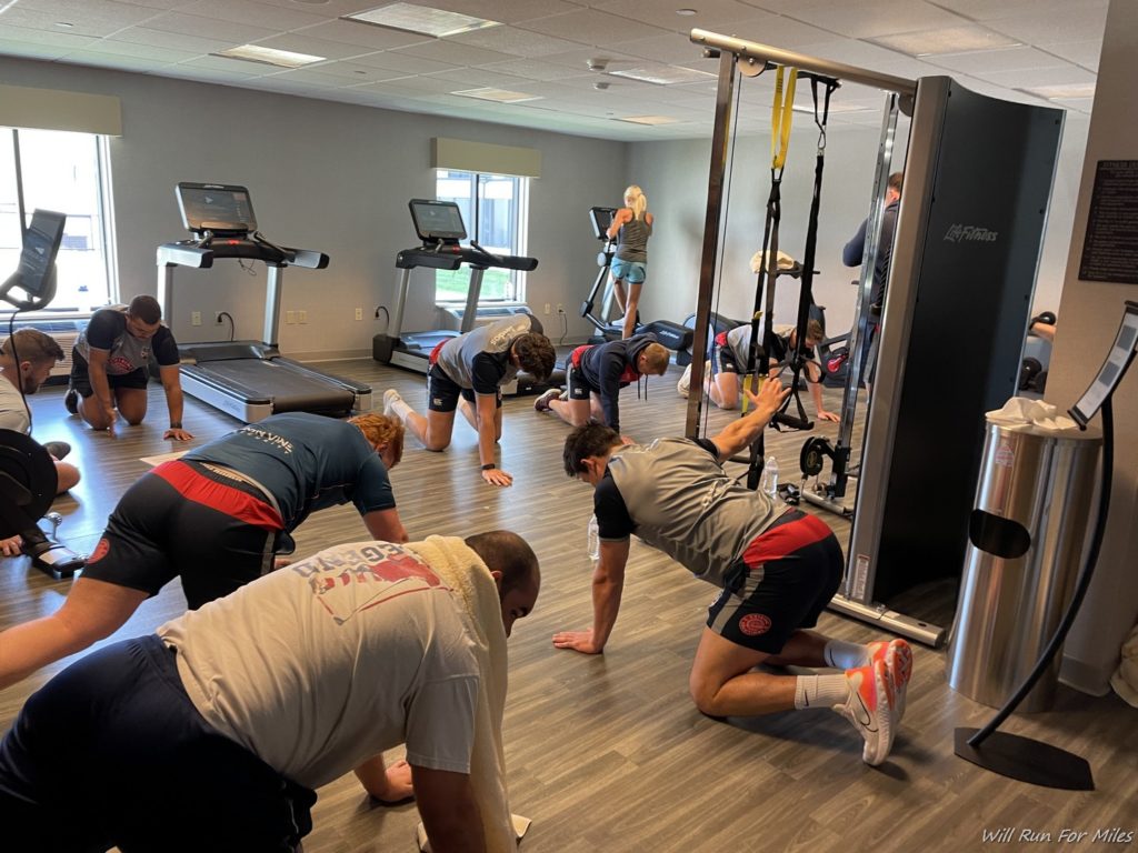 a group of people working out in a gym
