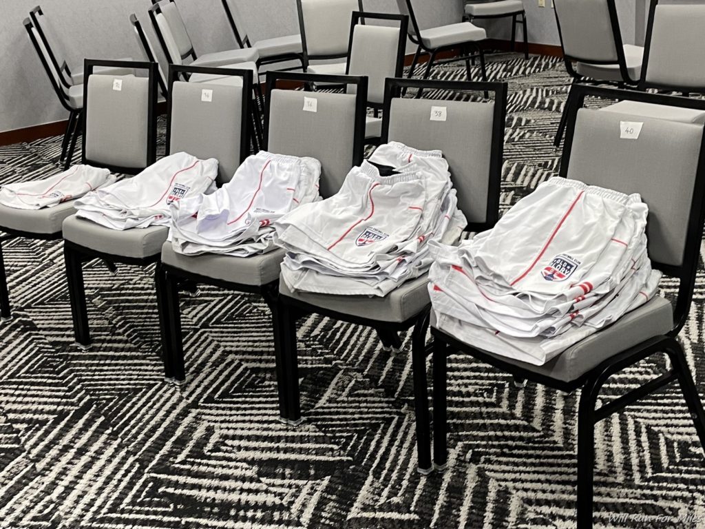 a group of chairs with pants on them