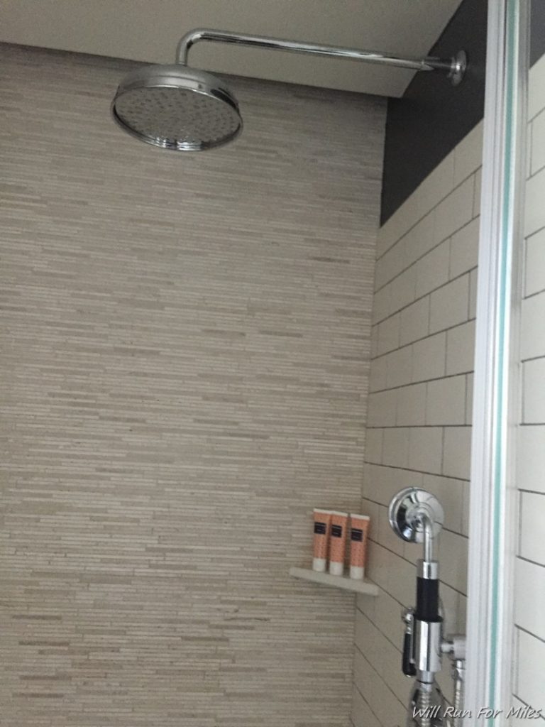 a shower head and shower head in a bathroom
