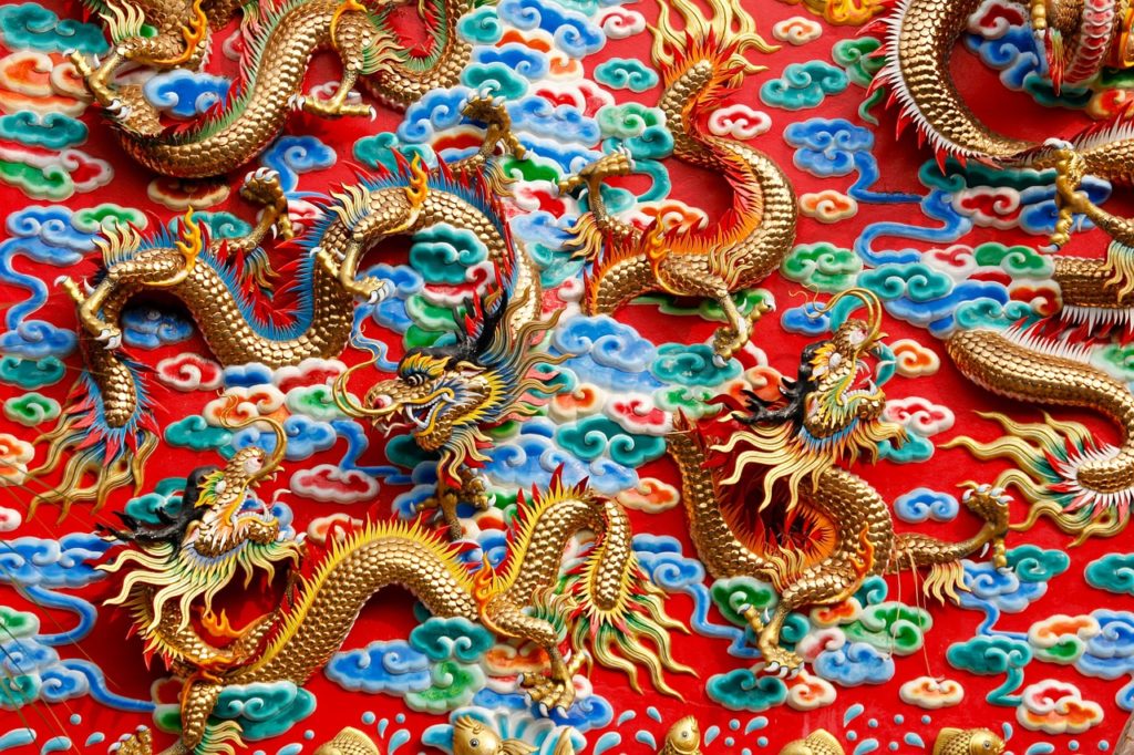 a wall with gold dragons