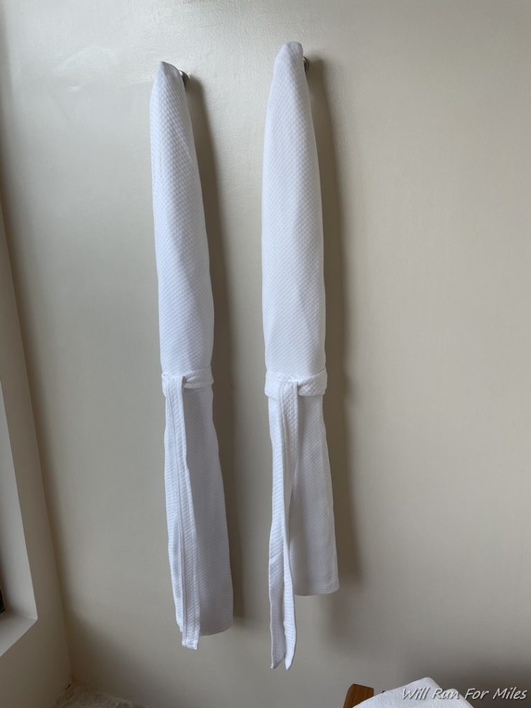 a pair of white towels on a hook
