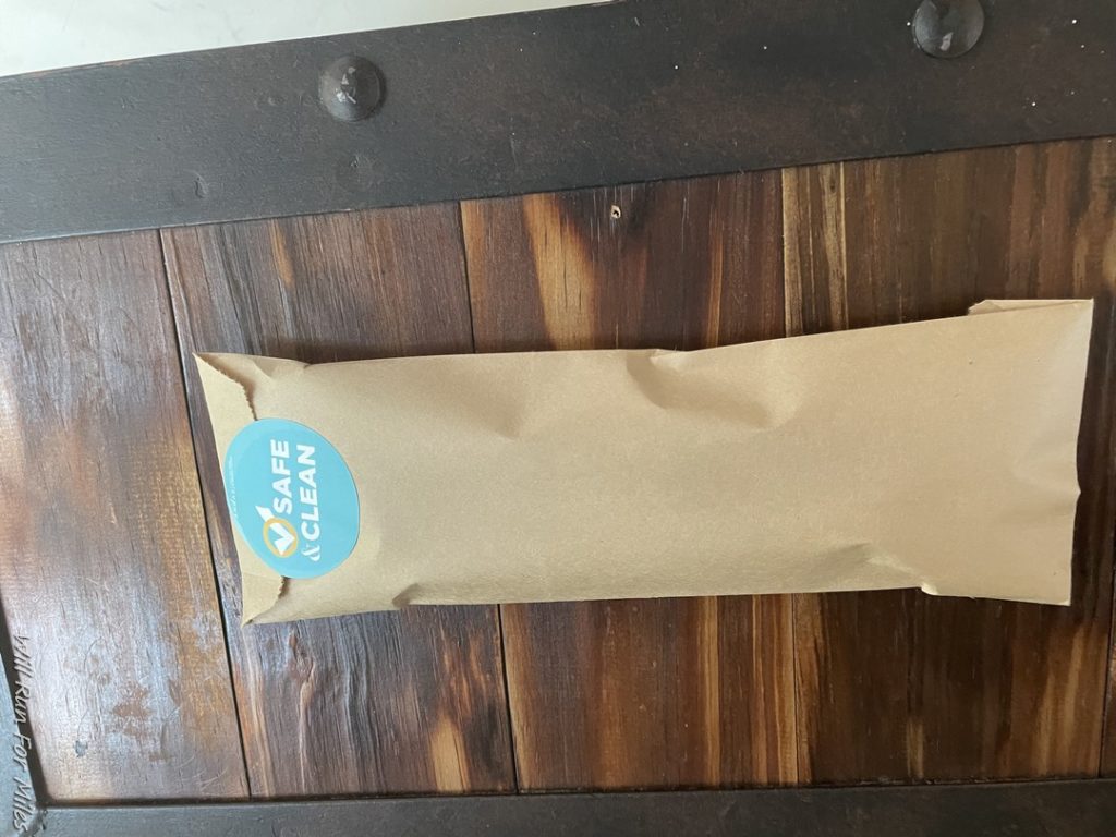 a brown bag on a wood surface