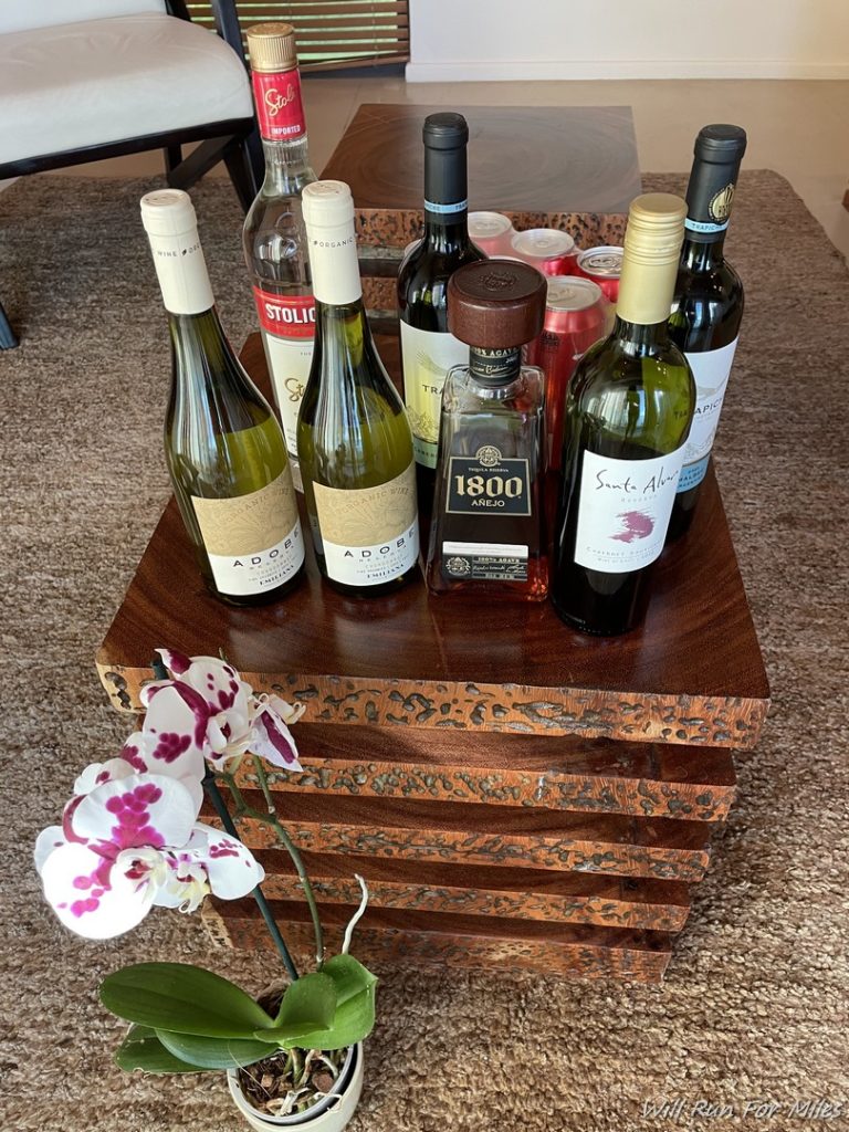 a group of bottles of alcohol on a wooden box