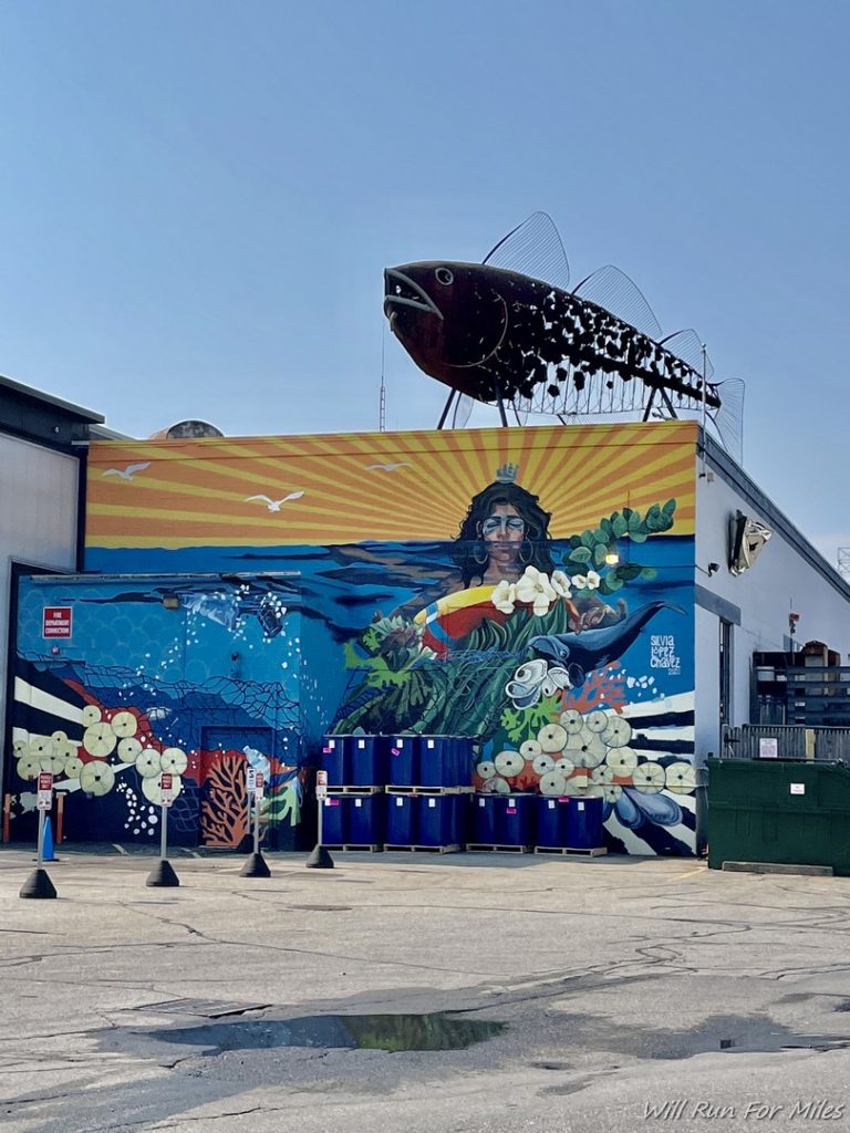 a large fish mural on a building