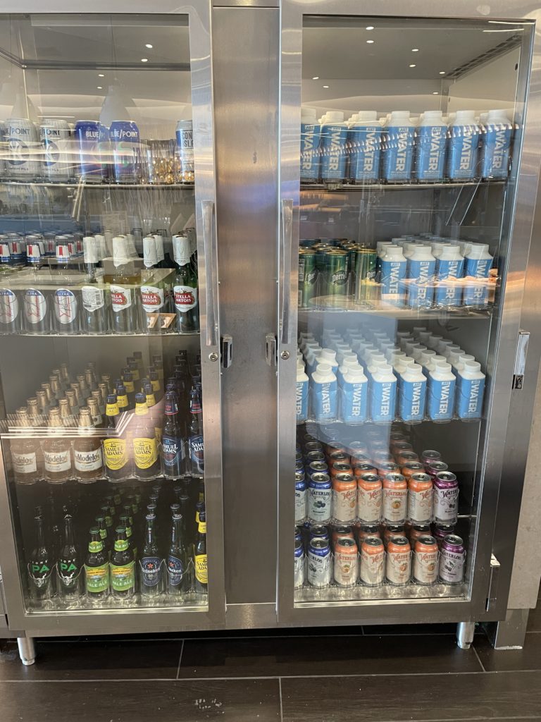 a display case with bottles and cans of beer