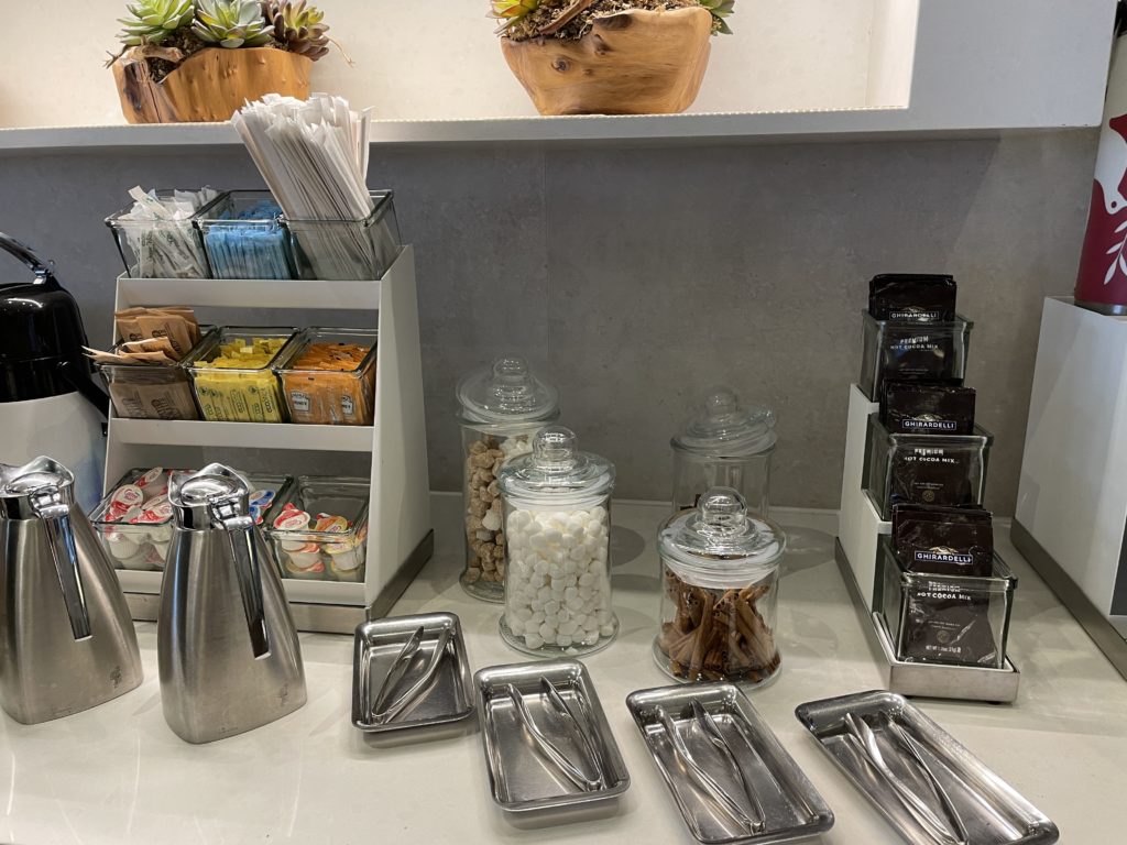 a counter with a variety of containers and utensils