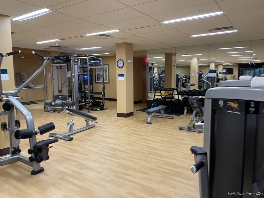 a gym with many exercise equipment