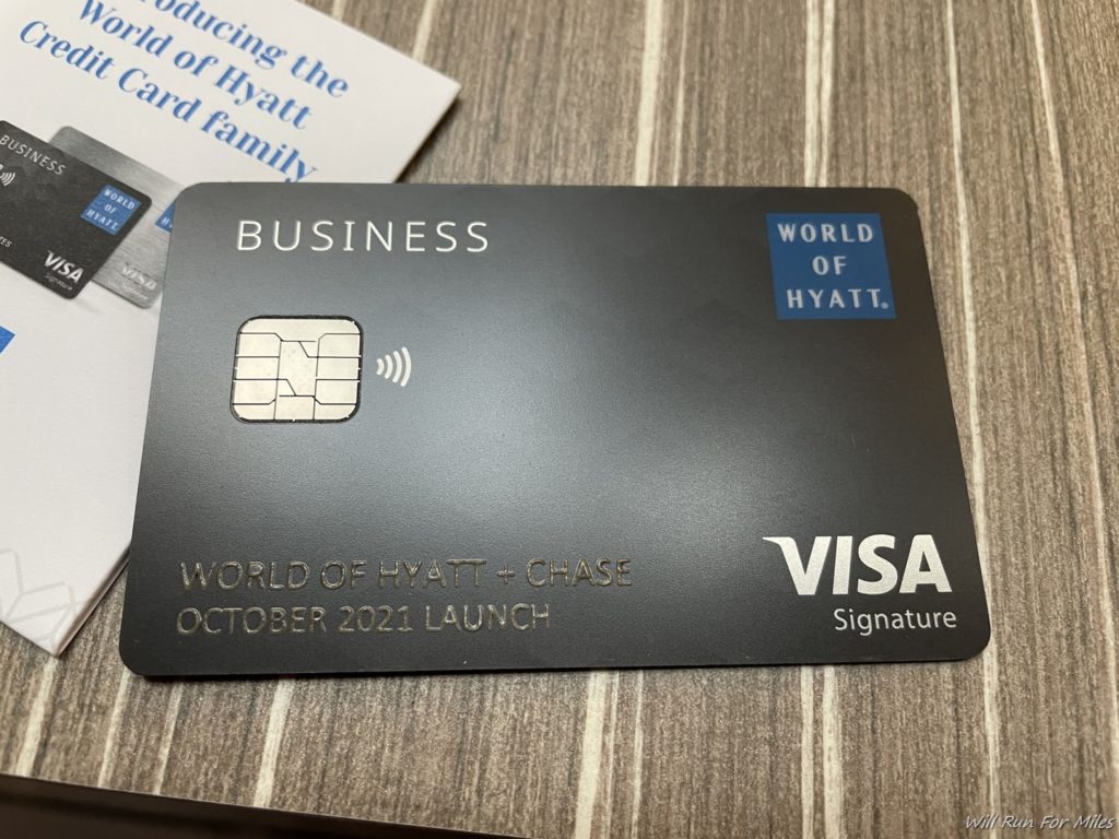 a black credit card on a wood surface