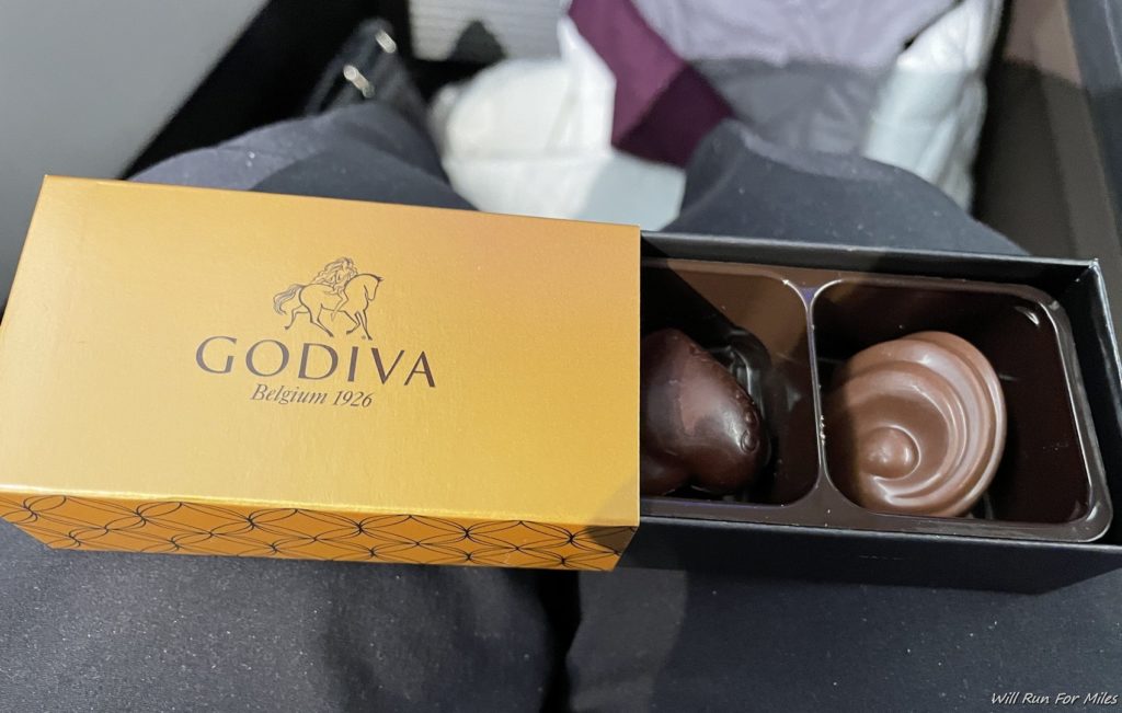 a box of chocolates on a person's lap