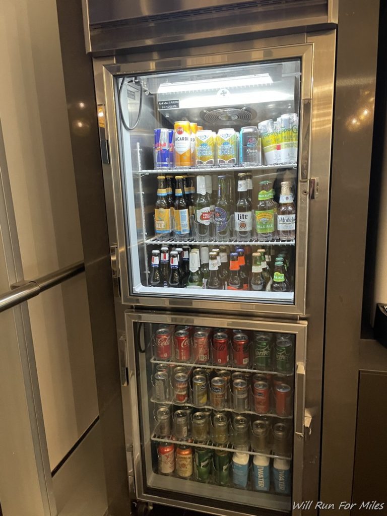 a refrigerator with drinks and cans