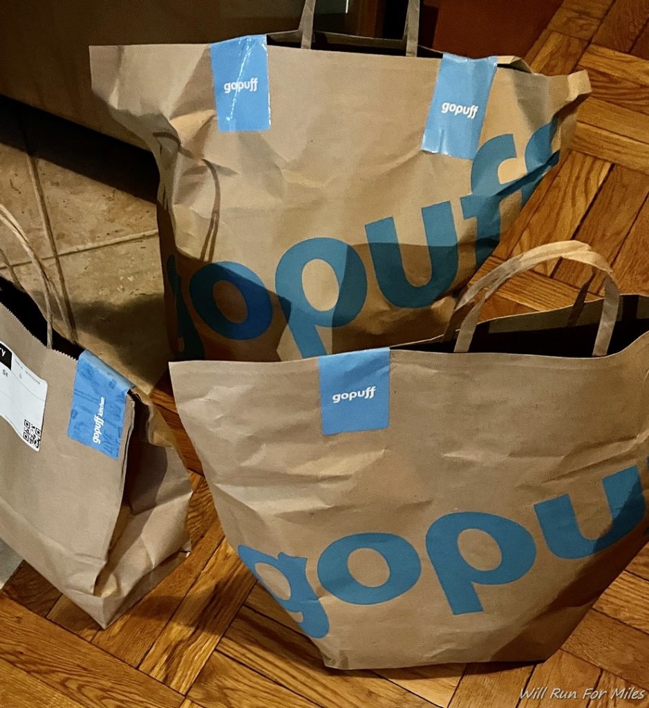 a group of brown paper bags with blue text on them