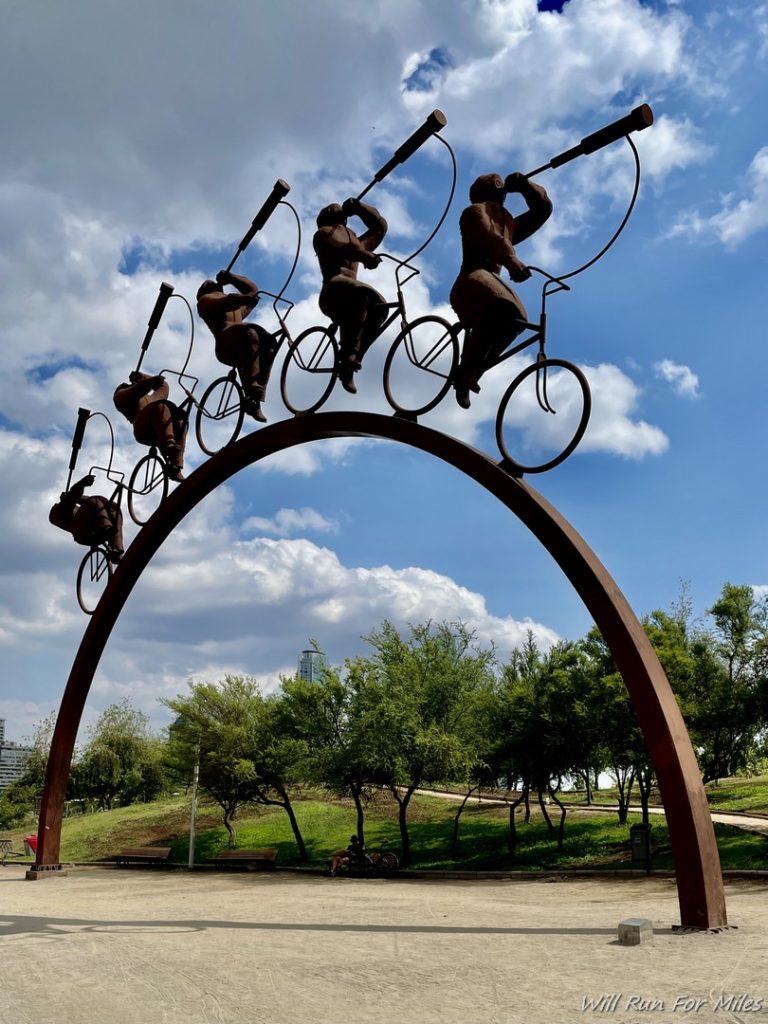 a statue of a group of people on bicycles