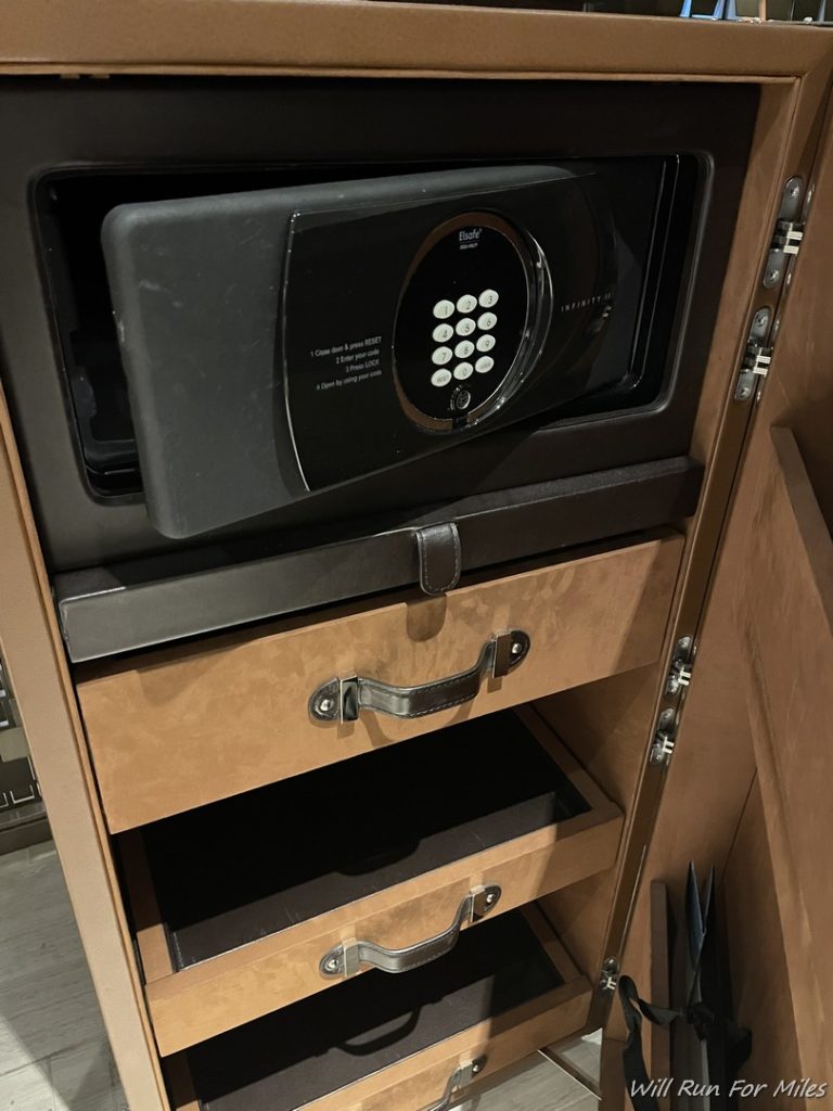 a safe in a wooden cabinet