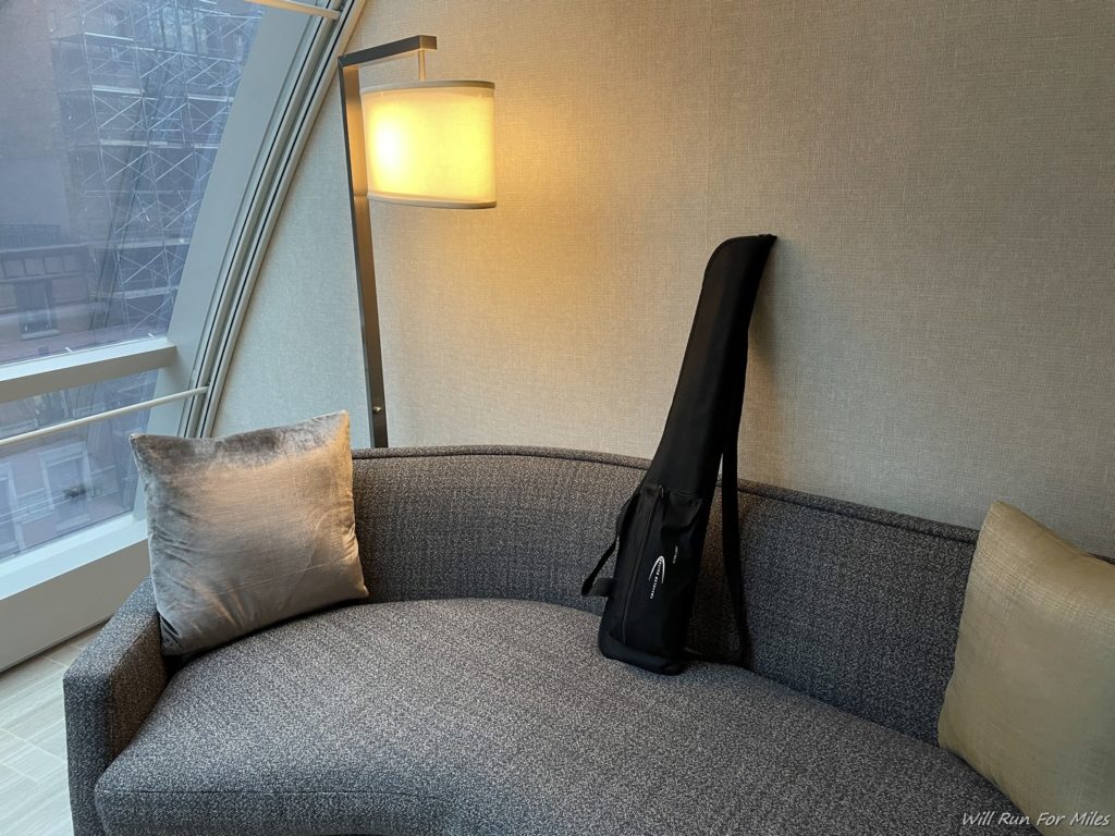 a guitar case on a couch