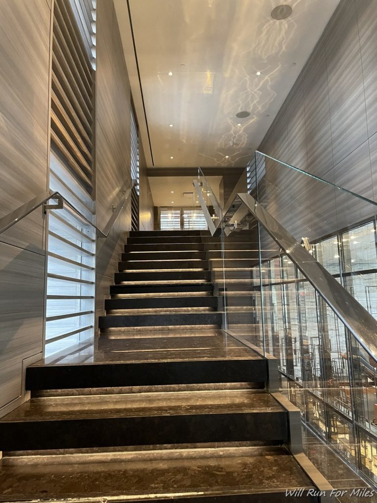 a staircase with glass railings