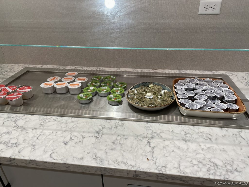 a trays of yogurt and other food items on a counter