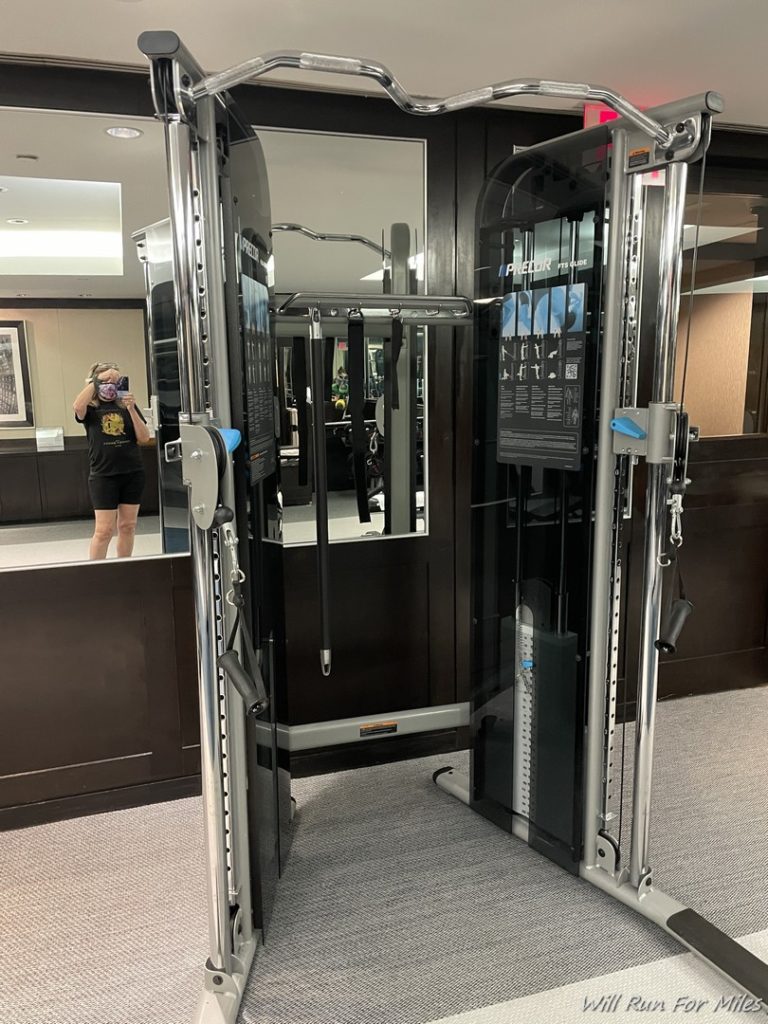 a mirror with a machine in front of a mirror