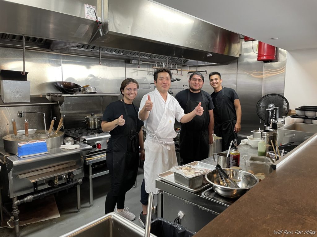 a group of people in a kitchen