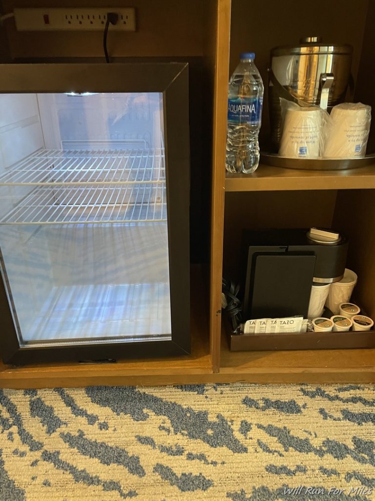 a shelf with a glass door and a glass door