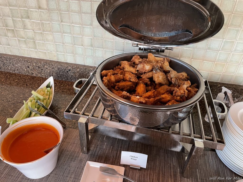 a bowl of chicken wings on a rack