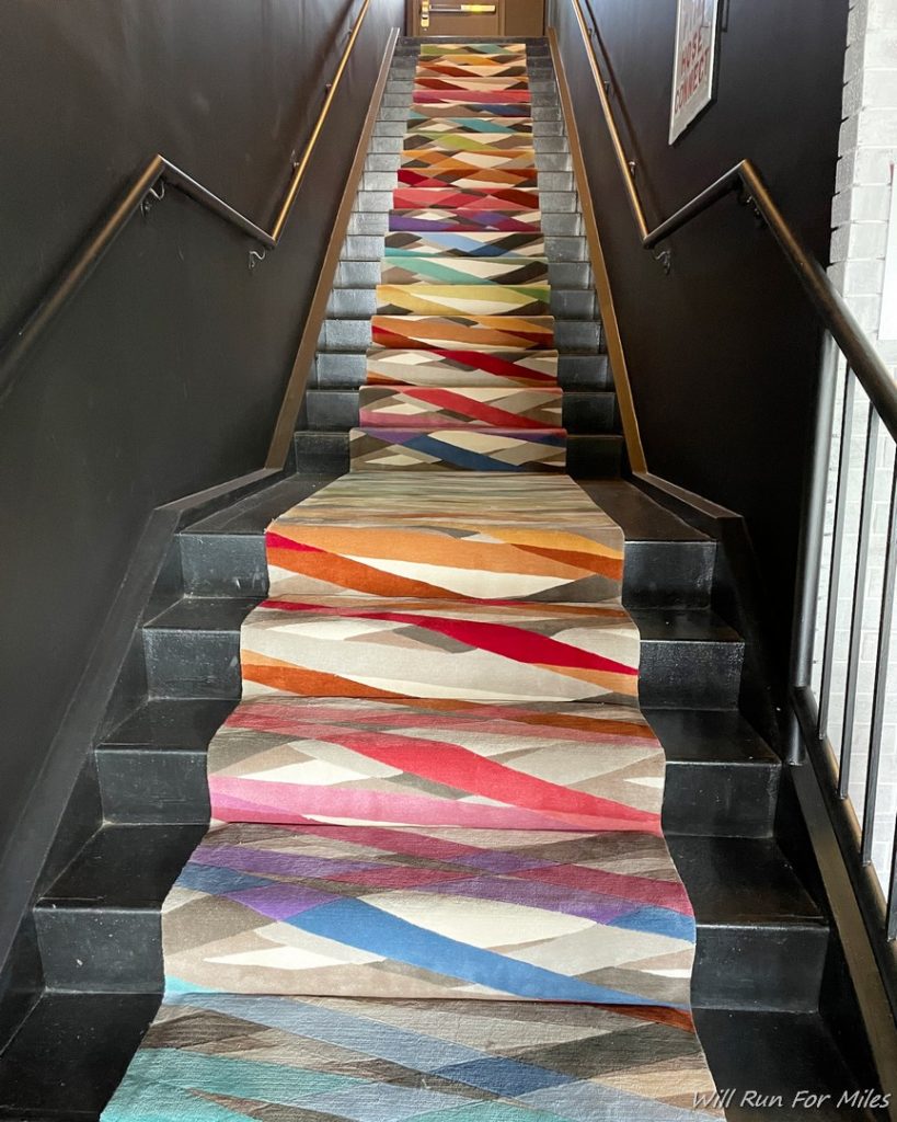 a multicolored carpeted staircase