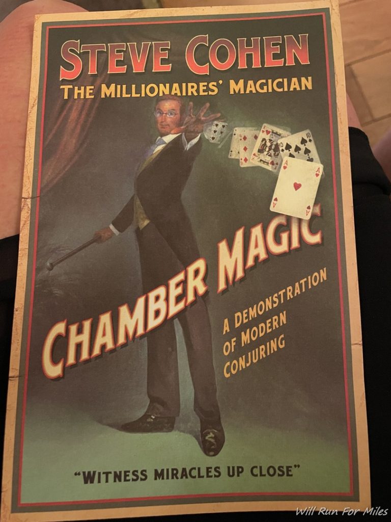 a book cover with a man in a suit and a juggling stick