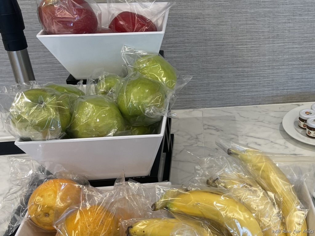 fruit in plastic bags on a counter
