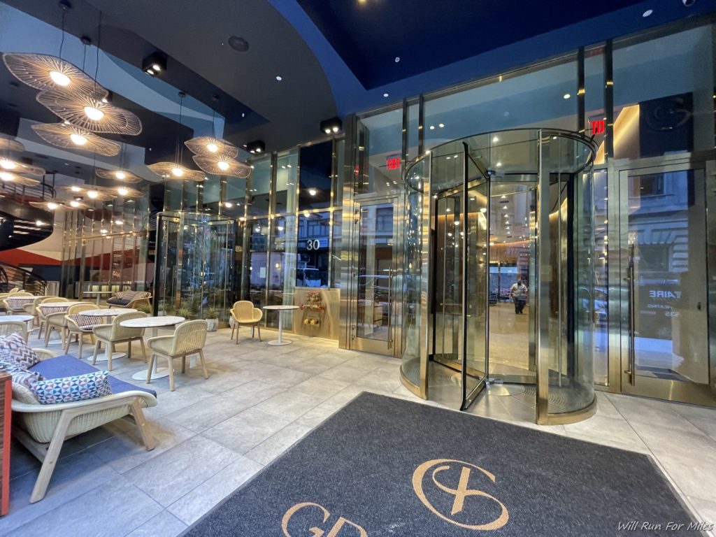a glass elevator with a round door