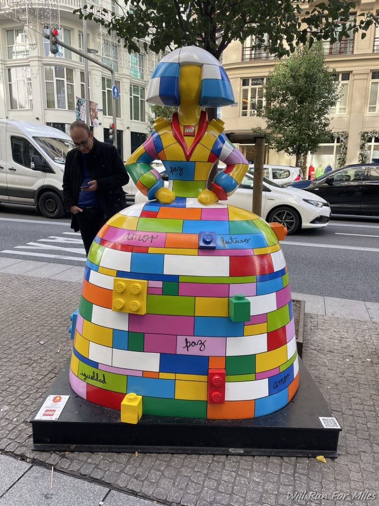 a colorful statue on a street