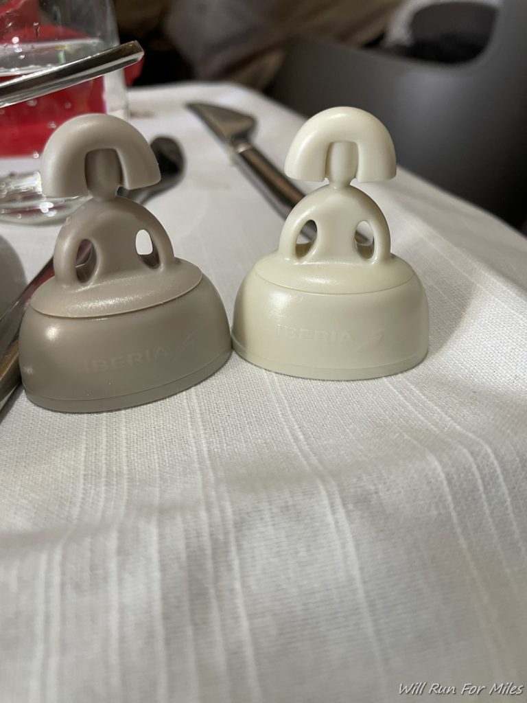 a couple of plastic bell holders on a table