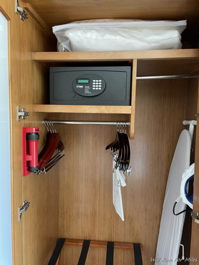 a black safe and swingers in a closet