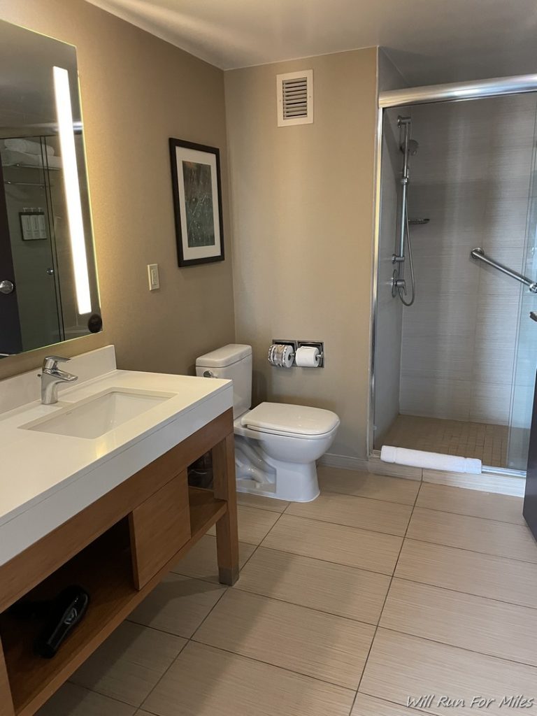 a bathroom with a sink and shower