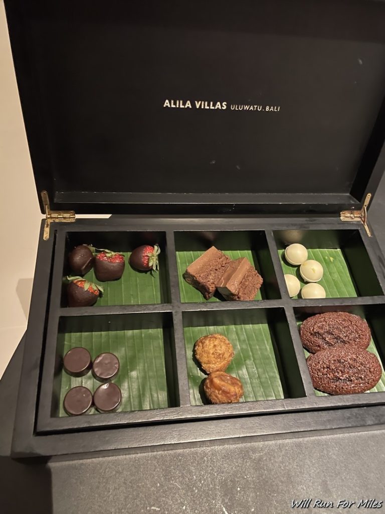 a box with different types of chocolates and cookies