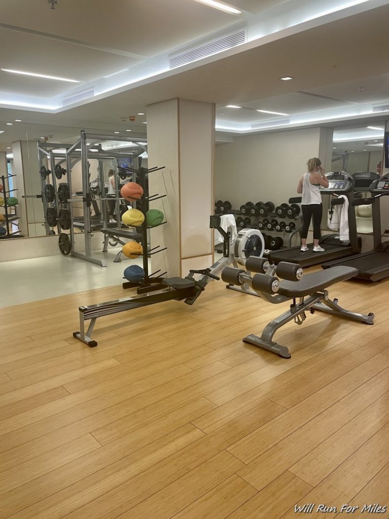 a gym with a mirror and exercise equipment