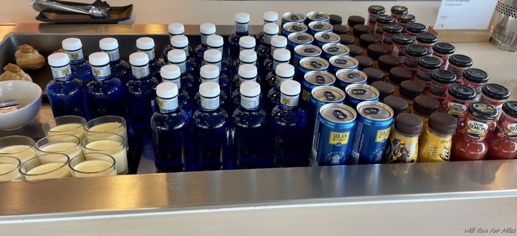 a group of blue bottles and cans