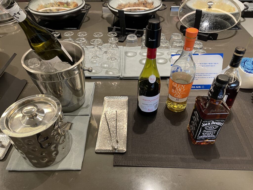 a table with bottles of alcohol and glasses
