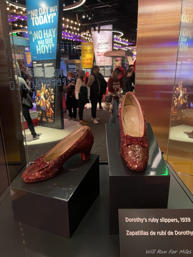 a pair of red shoes on display