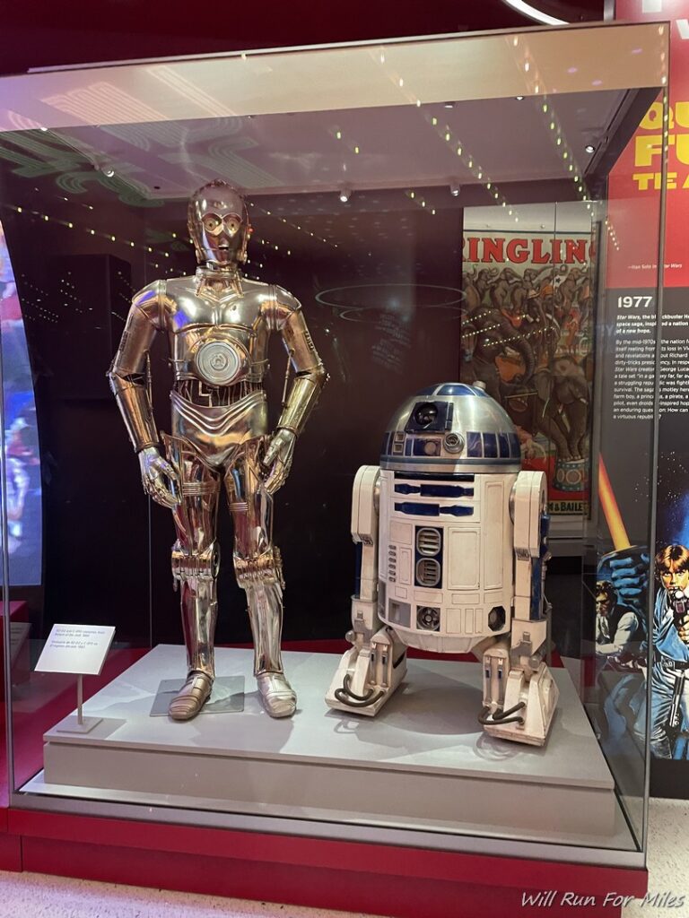 a robot and a robot in a glass case