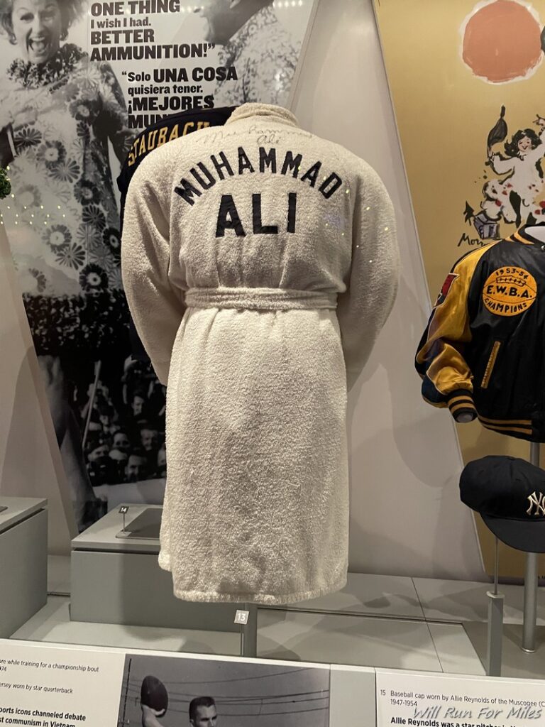 a white robe with black text on it