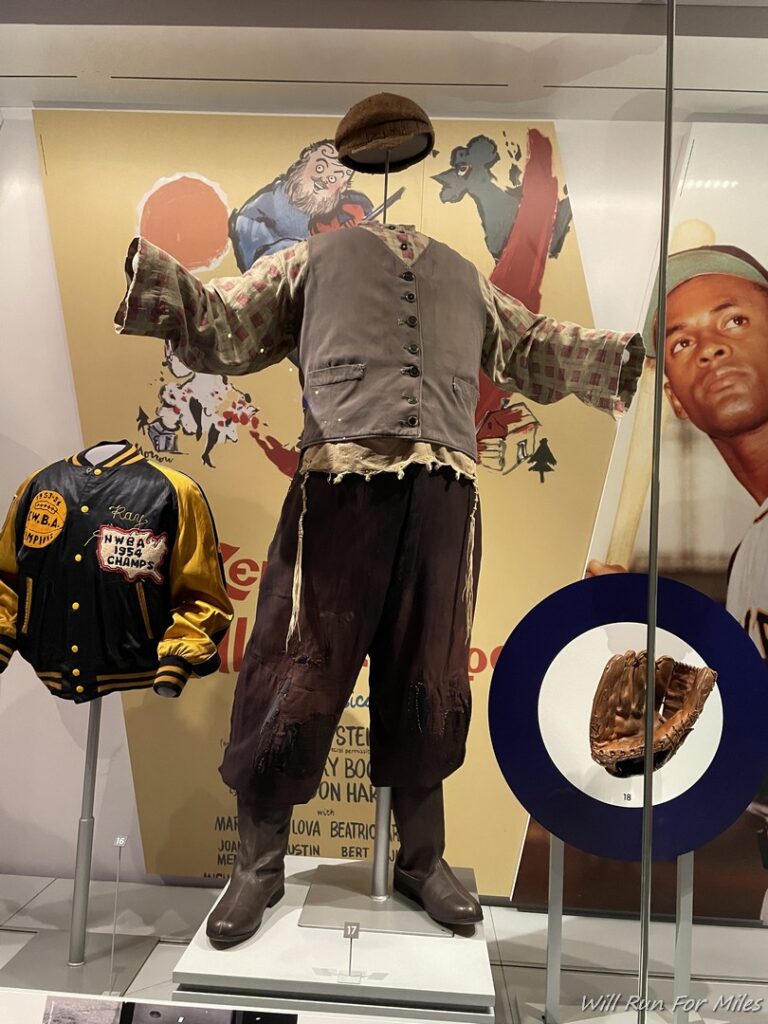 a mannequin with a hat and baseball jackets