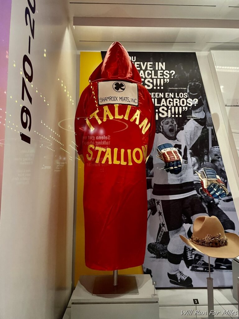a red boxing glove on a mannequin