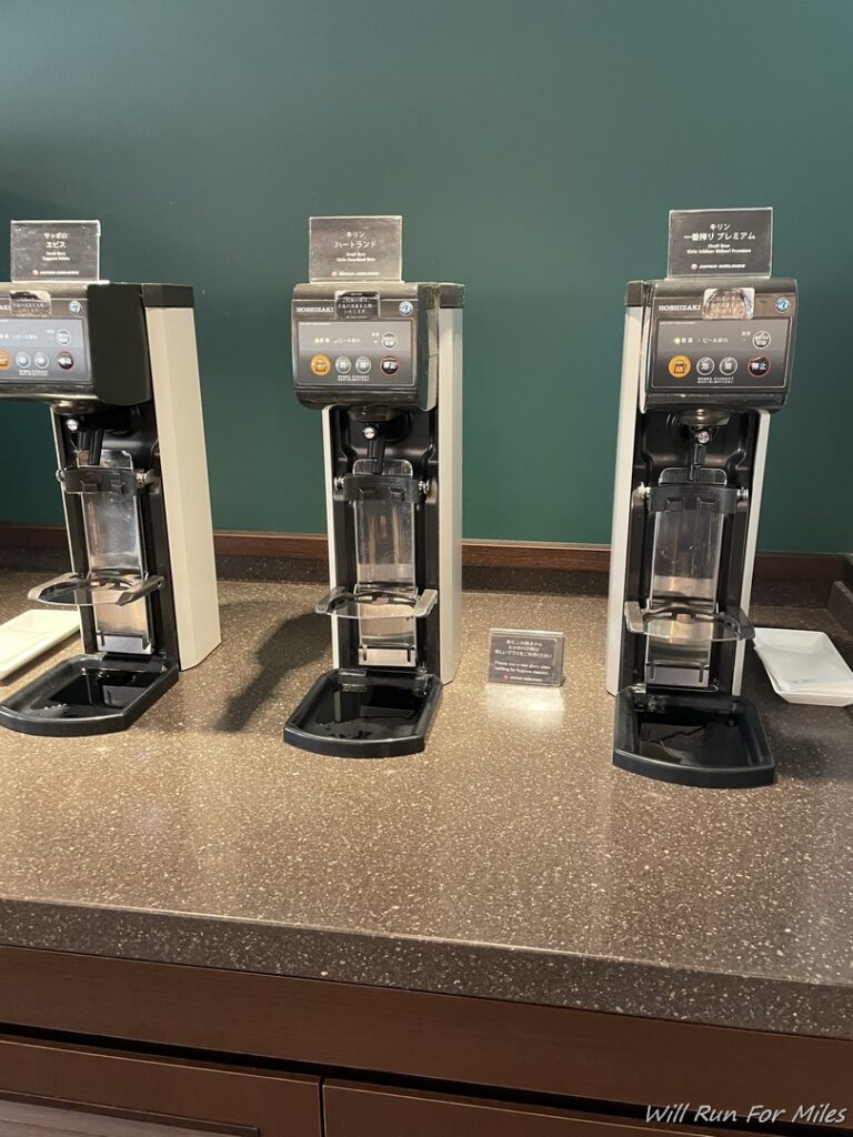 a group of coffee machines on a counter