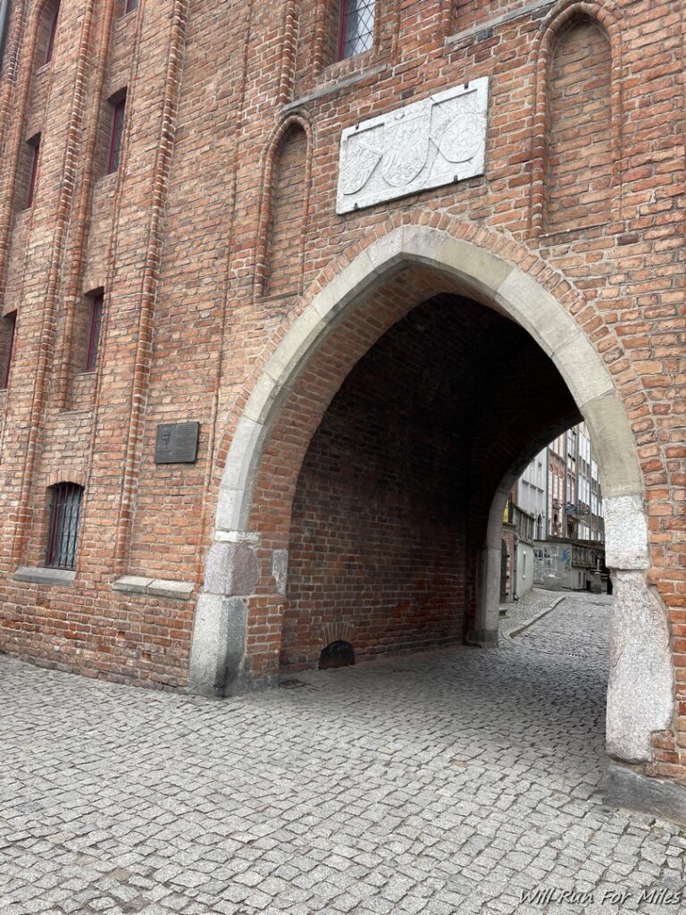 a brick building with a stone archway